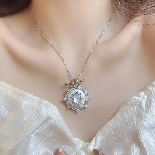 Model wearing Glittering Heart Necklace, side view highlighting design