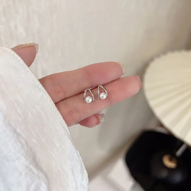 Silver Teardrop Pearl Stud Earrings close-up showing pearl luster