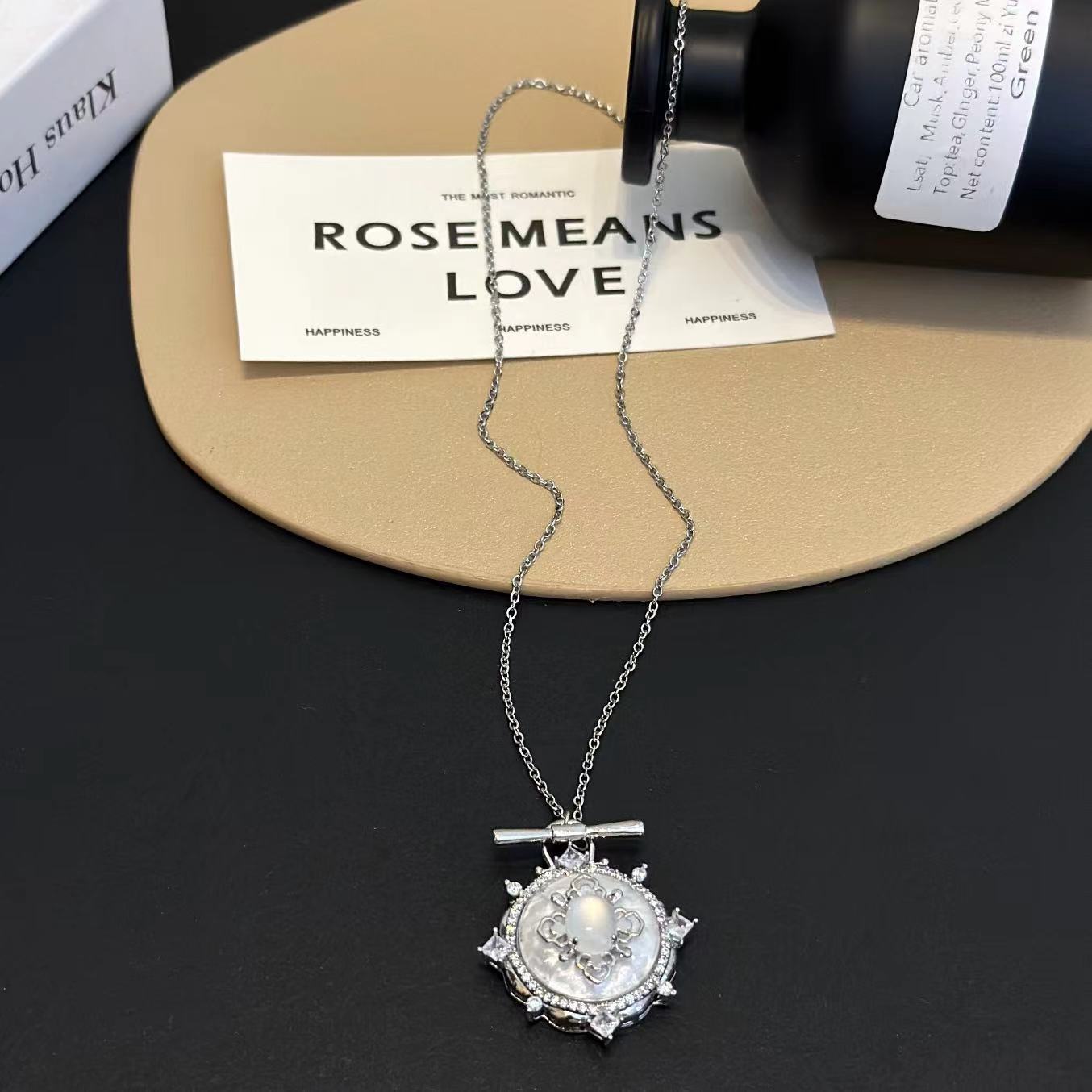 Detailed view of the heart-shaped pendant of Glittering Heart Necklace