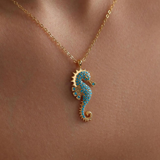 Model wearing Sea Horse Necklace, highlighting delicate details