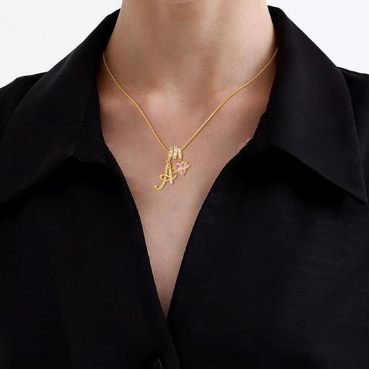Personalized A–Z gold letter necklace styled with layered necklaces