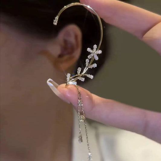 Snowflake Tassel Ear Cuffs showcasing celestial design and clip-on feature