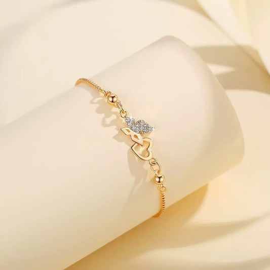 Elegant butterfly and heart charm bracelet by CotaJewelry