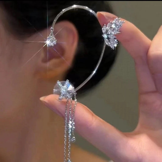 Close-up of Rotating Floral Tassel Ear Cuffs highlighting gold-tone electroplating and floral motif