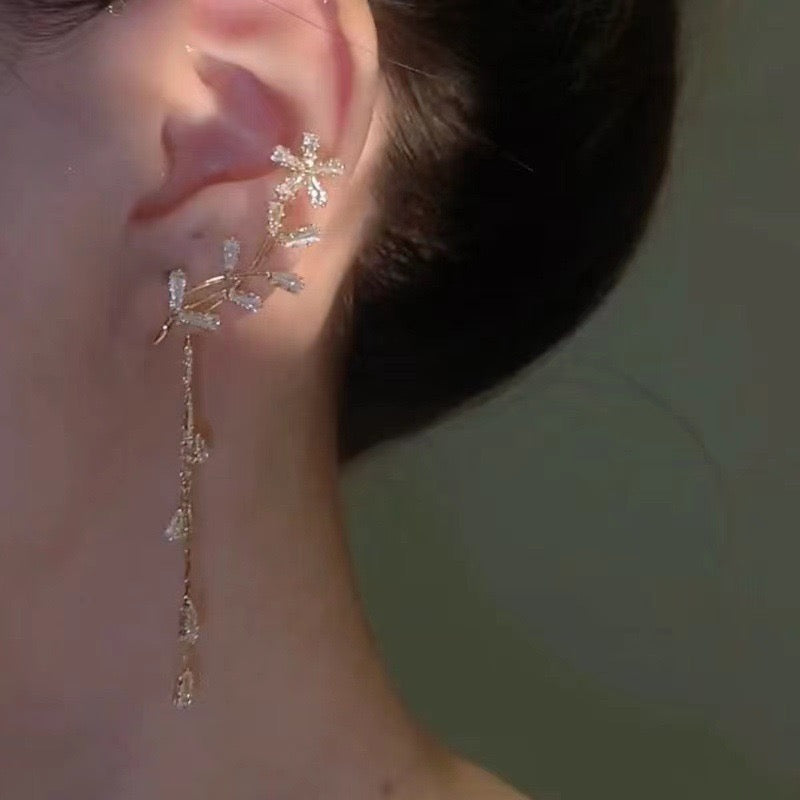 Model wearing Snowflake Tassel Ear Cuffs showcasing celestial design and clip-on fit