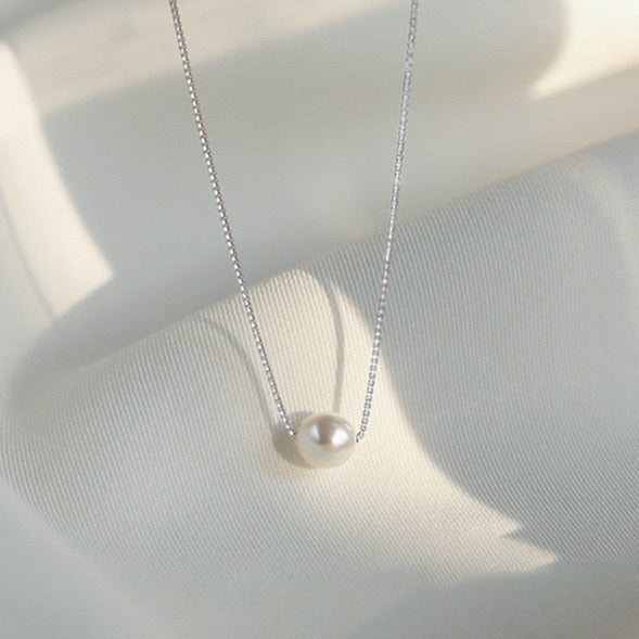 Model styling Eternal Pearl Necklace with casual chic look