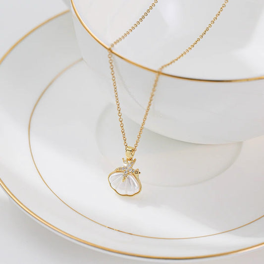 Whispers of the Tide: Dive into the Enchanting World of Our Starfish & Seashell Pendant Necklace