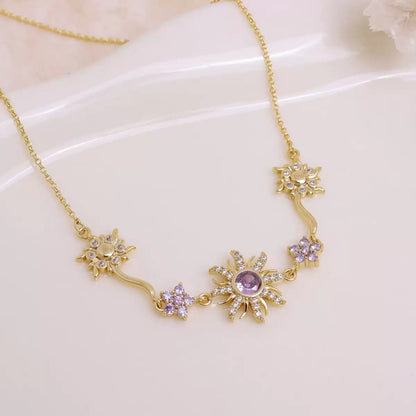 Close-up of sunflower necklace with sparkling purple crystal center