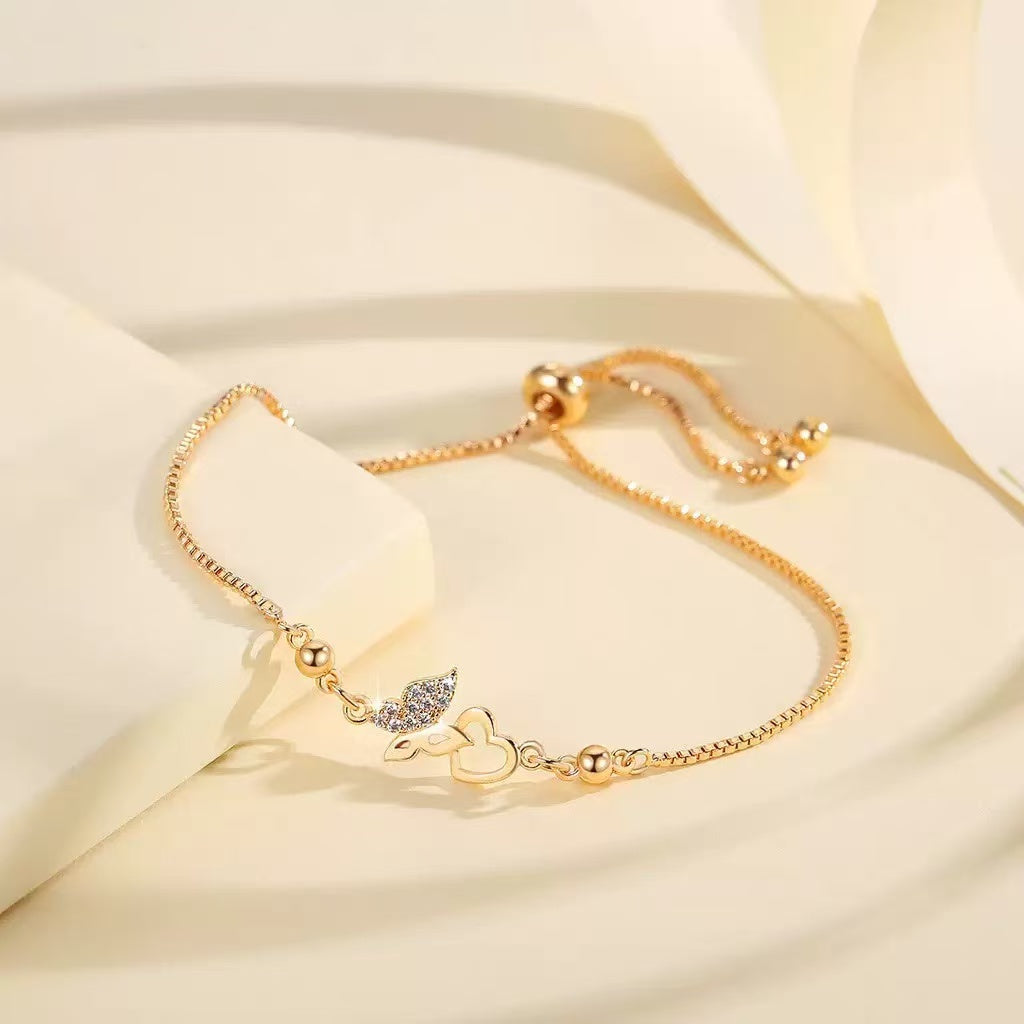Sparkling cubic zirconia bracelet with butterfly heart design