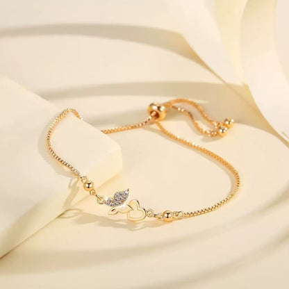 Sparkling cubic zirconia bracelet with butterfly heart design