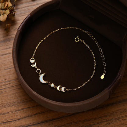 Celestial silver bracelet featuring moon phase design for women